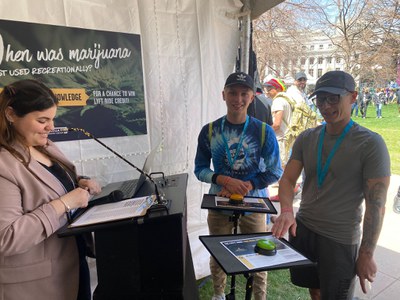 Festival attendees at CDOT booth taking cannabis safety quiz