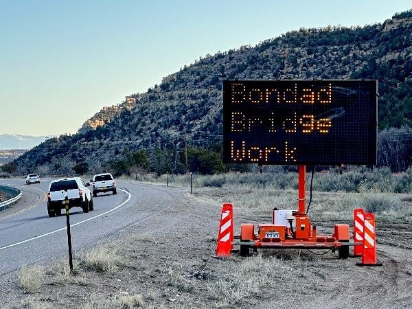 VMS sign on US 550 reminds commuters to expect delays next week while CDOT crews repair potholes on the bridge south of Bondad Hill